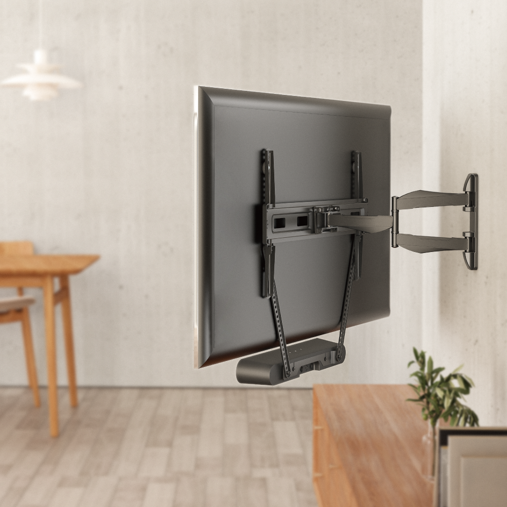 VSYS VSSB-49 soundbar bracket installed below a wall-mounted TV