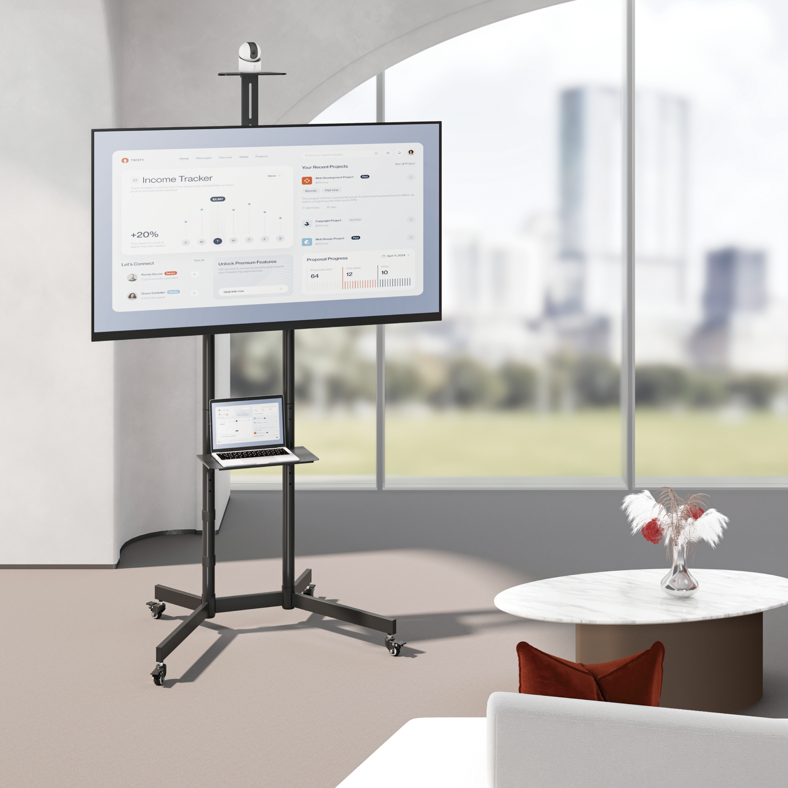 VSYS VTL-1042T mobile TV cart in an office with camera and laptop shelf in use